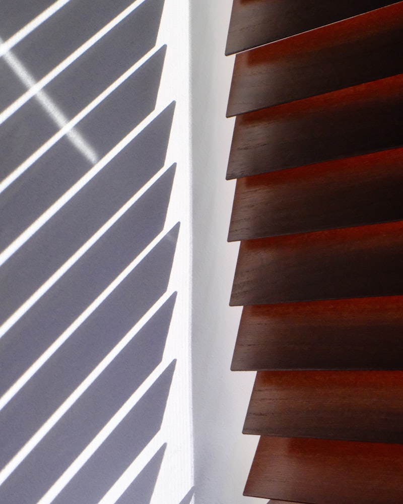 Real wood blind slats stained to match window trim