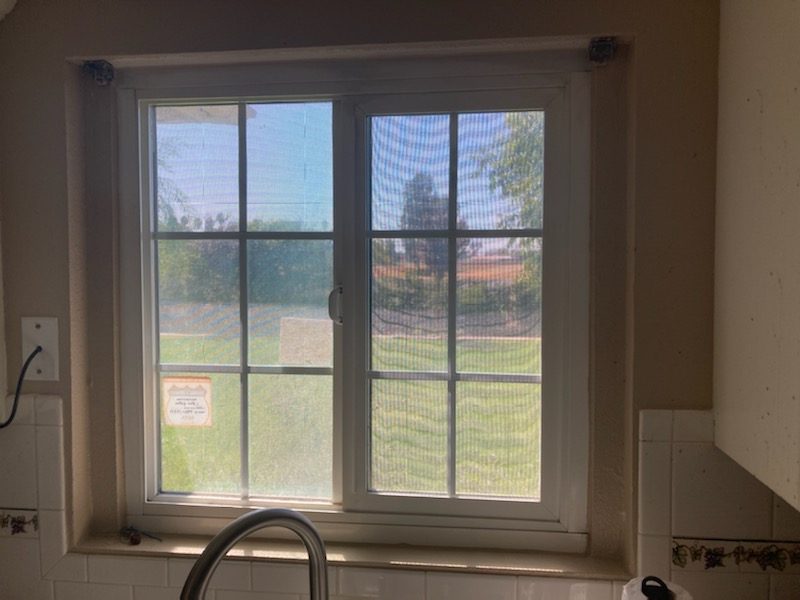 A solar screen, stopped on the outside of the glass.