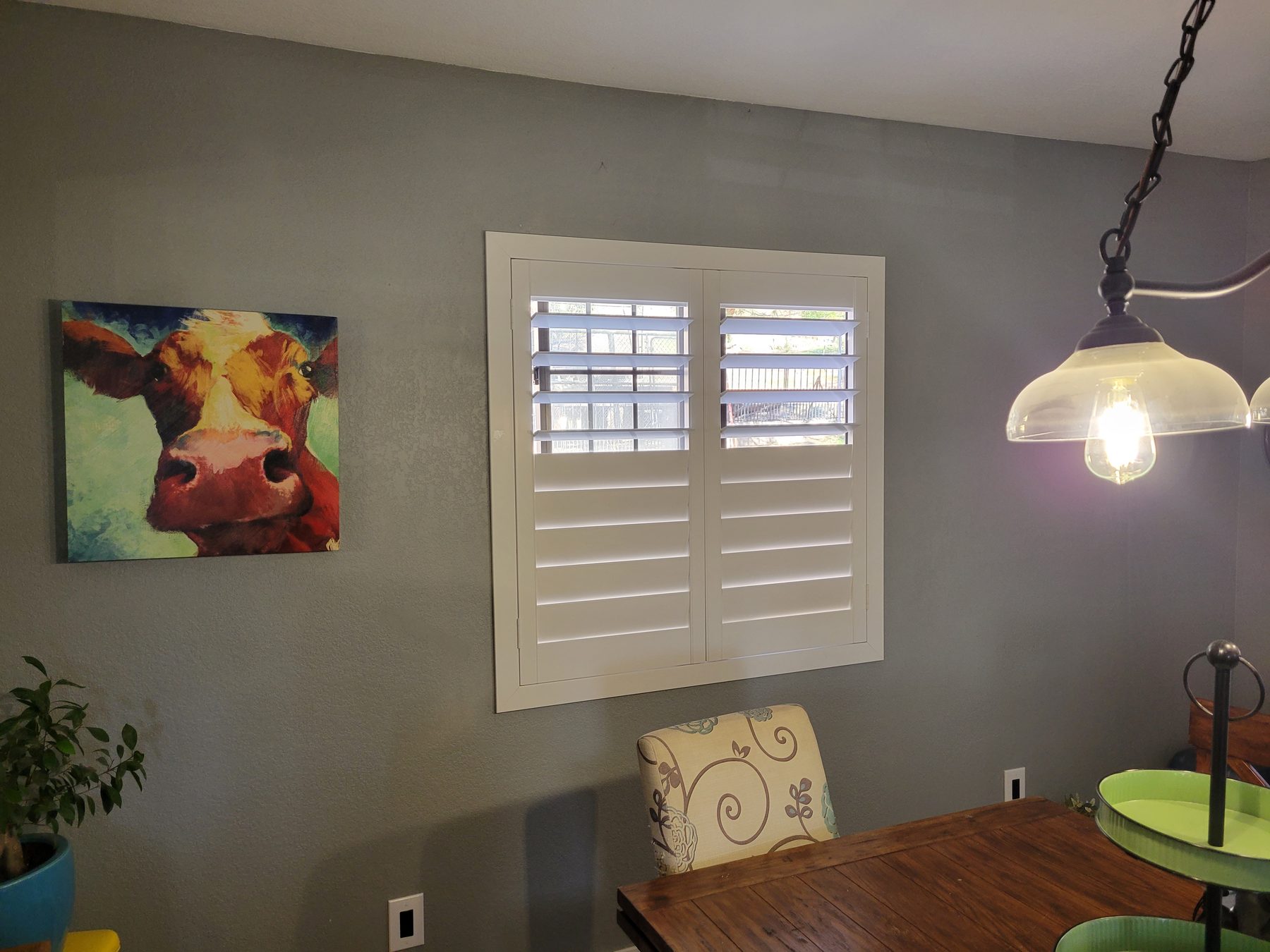 Shutters built to the opening, louvers set to the afternoon.