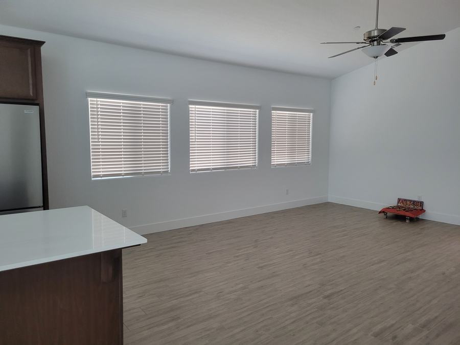 Great room, blinds wall to wall