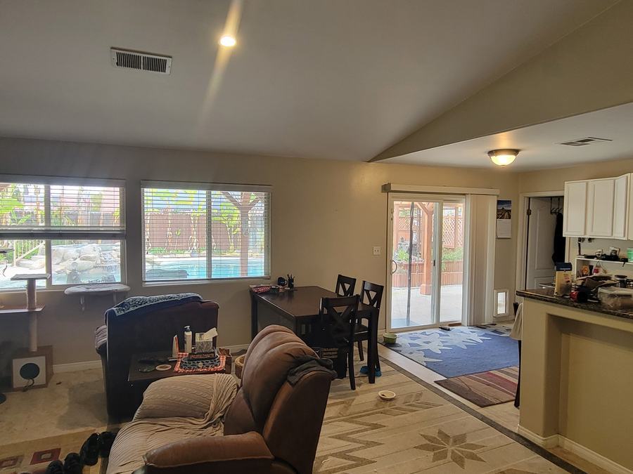 Living room, blinds and slider