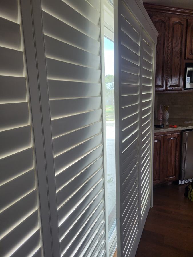 Louvers open onto the kitchen