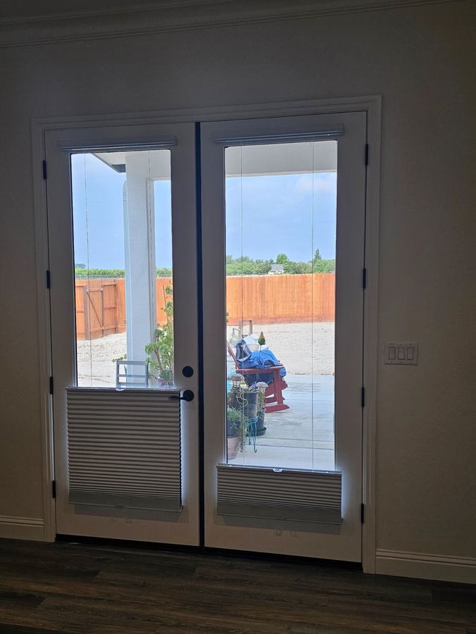 Cellular shades fitted to a French door pair