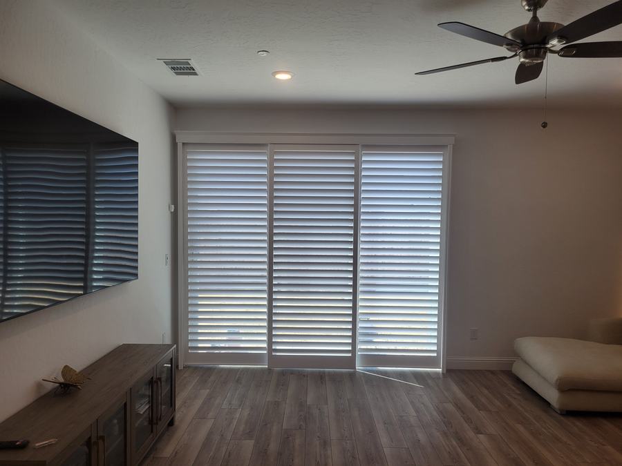 Shutter panels on a sliding door