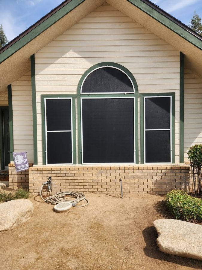 An arched screen on a gable window