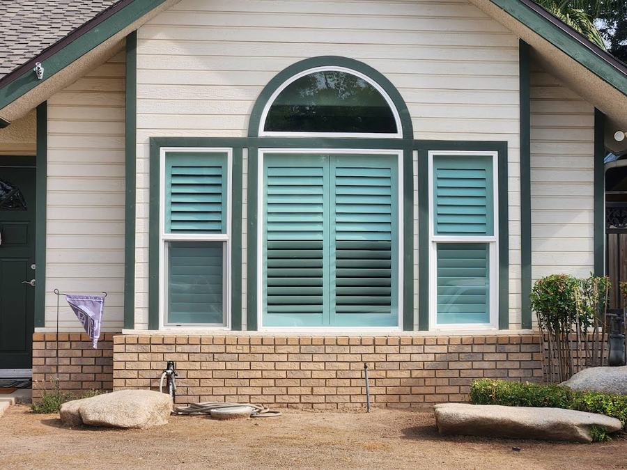 The same gable, shutters behind the glass