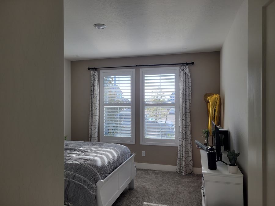 Bedroom, shutters under a curtain rod