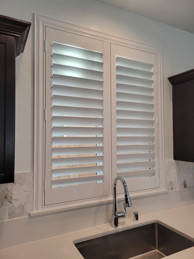 Kitchen shutters against dark cabinetry