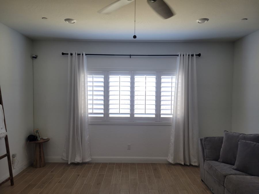 Shutters and floor length drapery