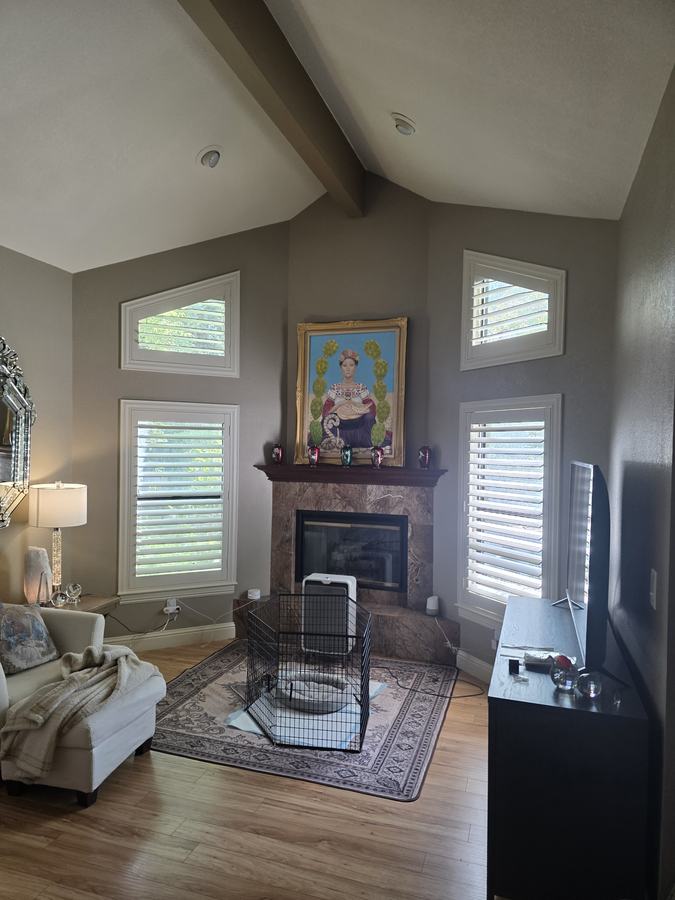 Fireplace wall, shutters either side