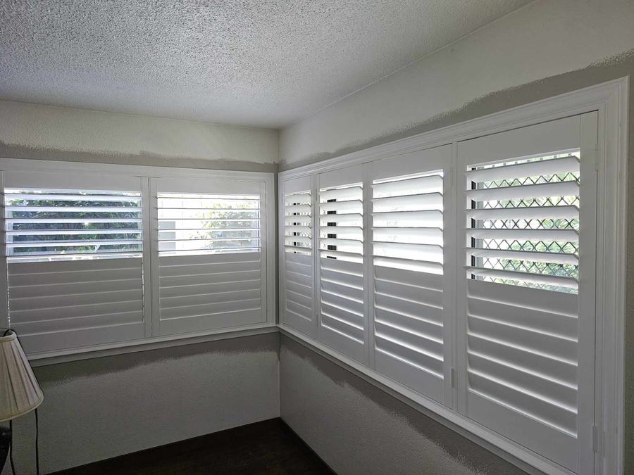 Corner windows, shutters on both walls