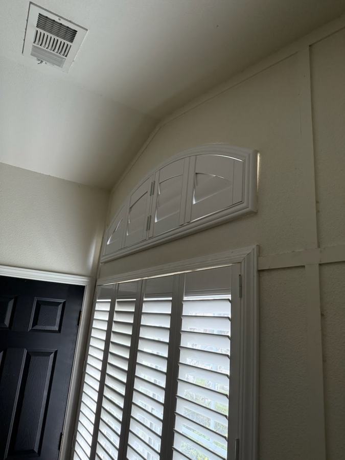 Eyebrow arch above a pair of shutters
