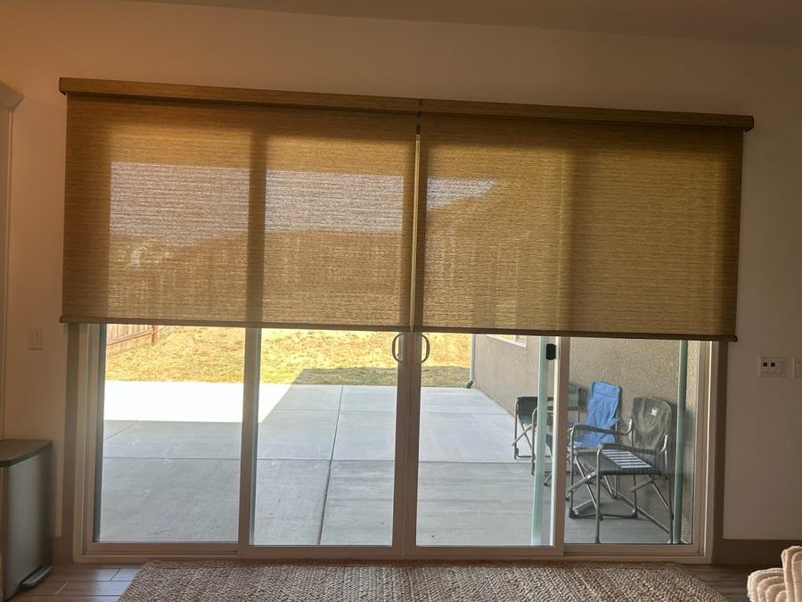 A woven wood shade on a patio slider
