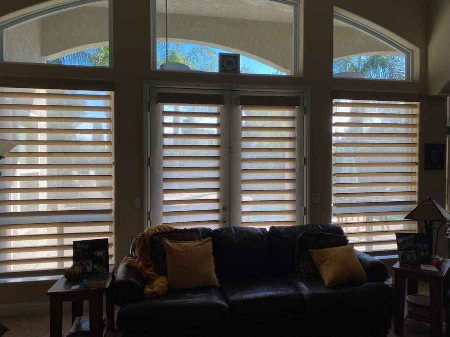 Sheer shades on a tall living room window